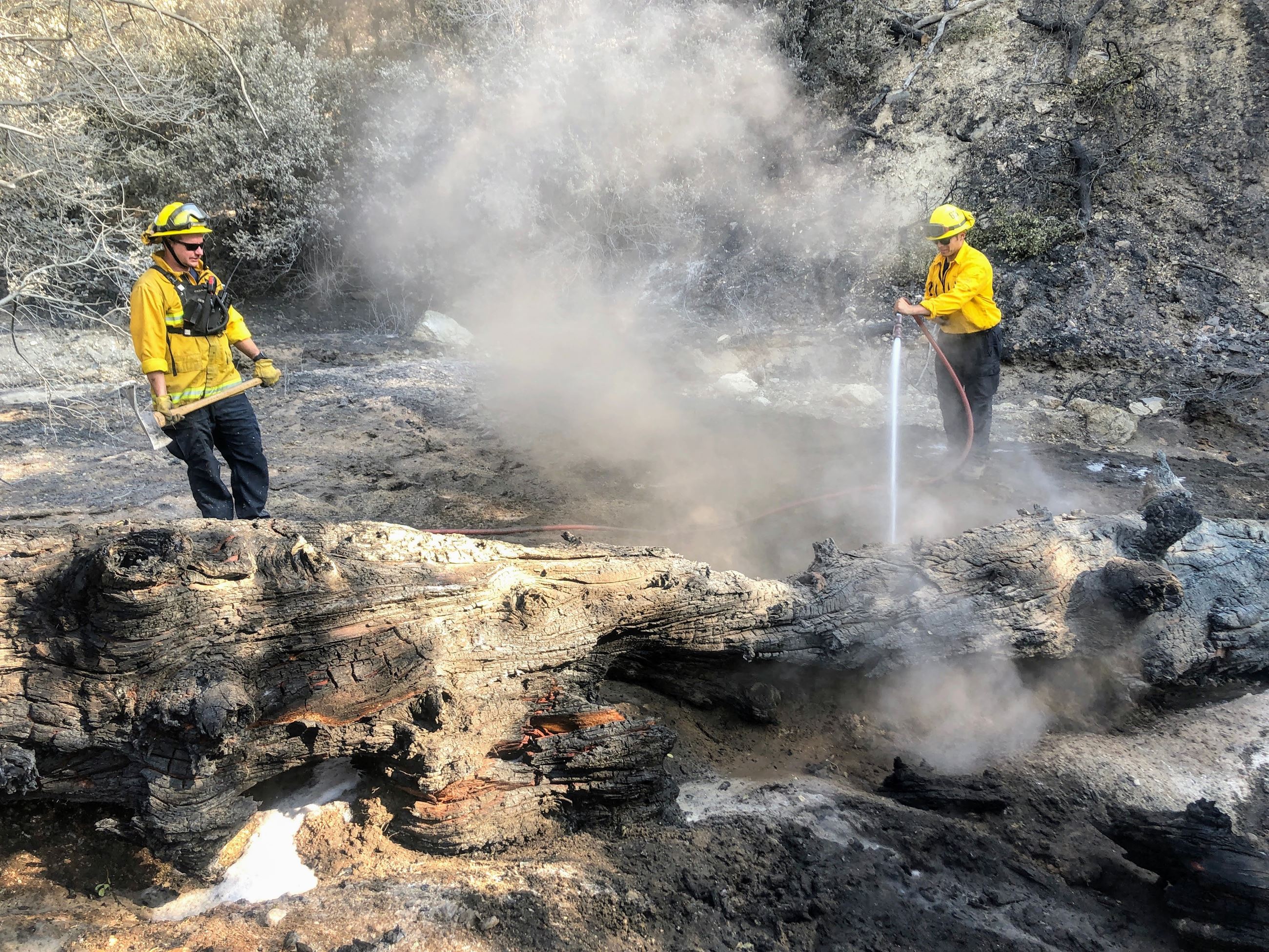 Firefighters clean up after Apple Fire August 2020