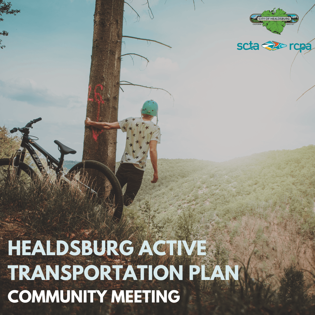 A guy on a mountain with his bicycle